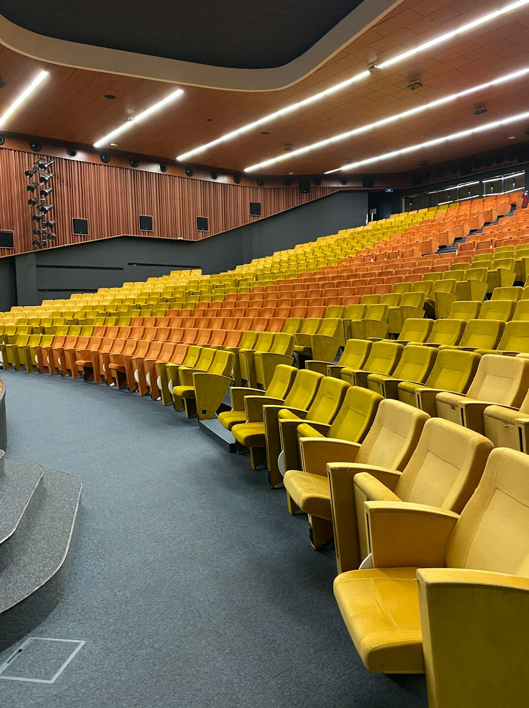 Lecture hall with adult learners listening to a speaker